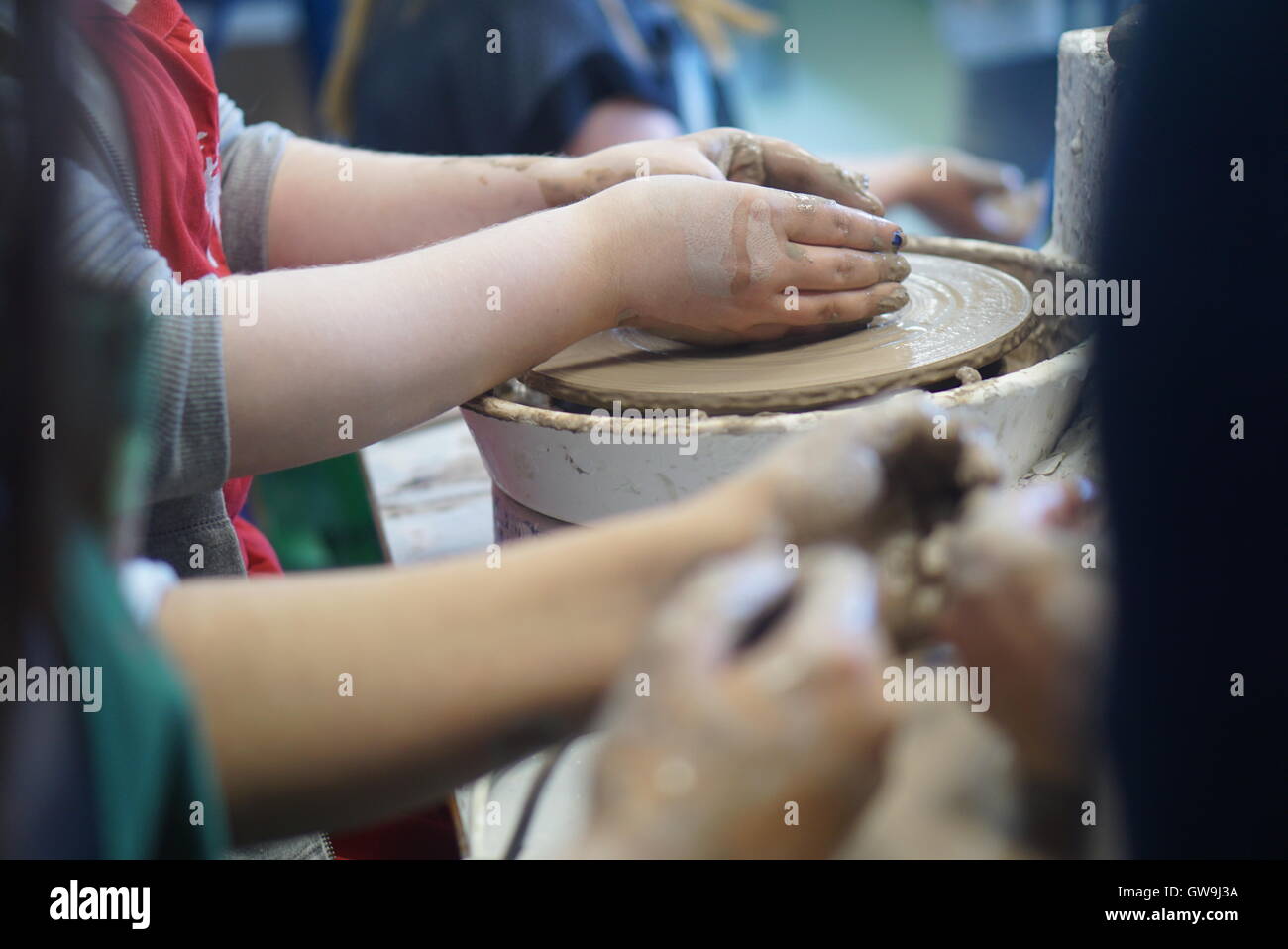 Photo of two friends taking part in a pottery class Stock Photo