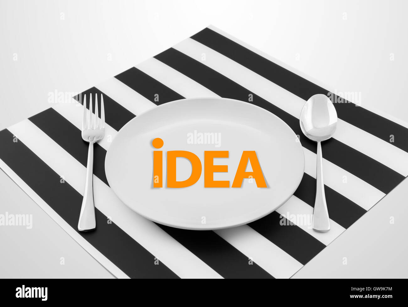 idea concept on ready to serve dish with spoon and fork, Successful concept Stock Photo