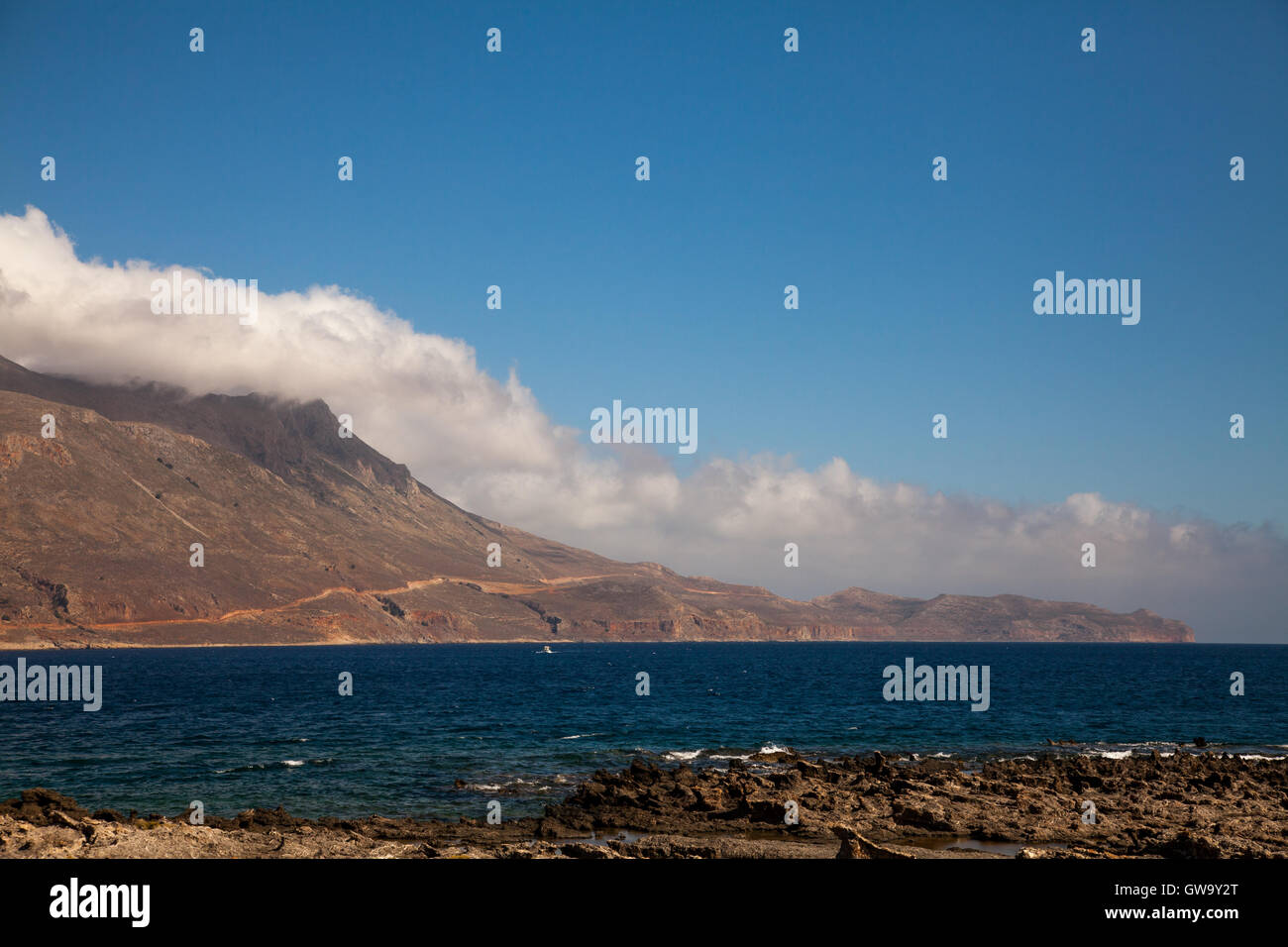 Peaceful mountain landscape with clear blue sky and white clouds hi-res ...