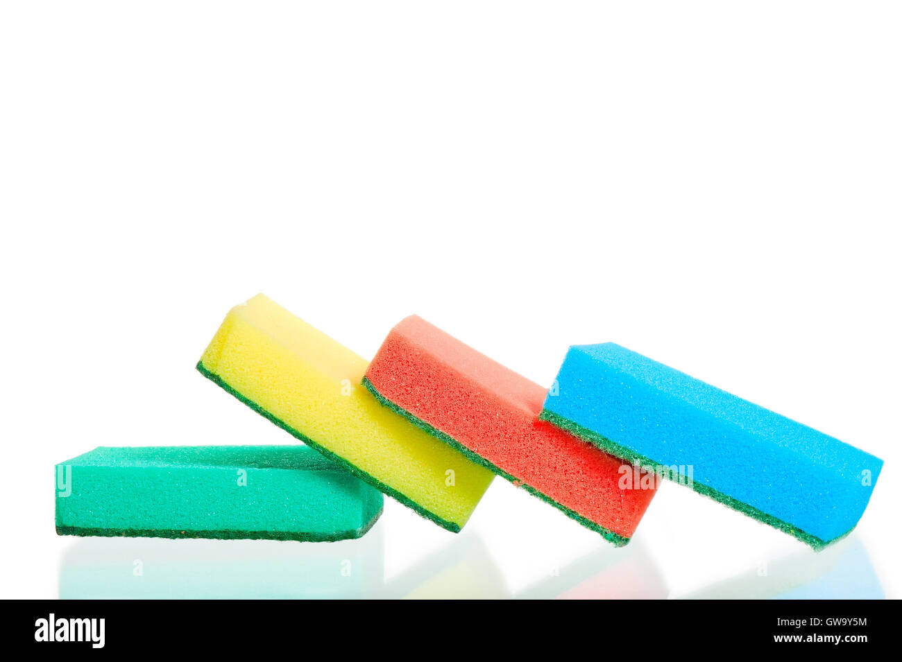 Four multi-colored sponges on white background Stock Photo