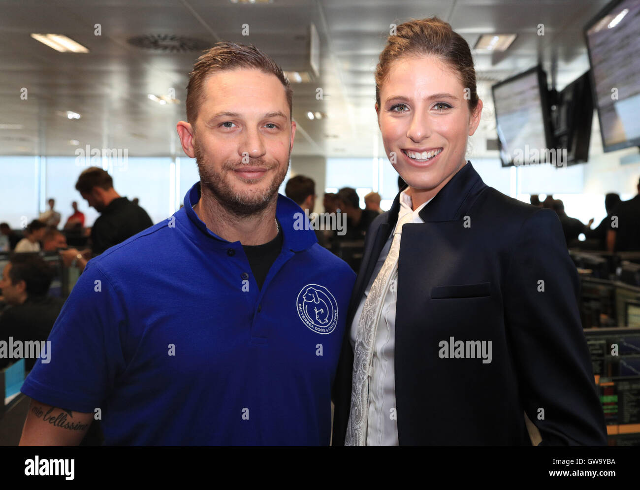 Tom Hardy (left) and Johanna Konta take part in the 12th BGC Annual Charity Day at Canary Wharf in London, in commemoration of the 658 employees lost in the World Trade Center attacks on 9/11. Stock Photo