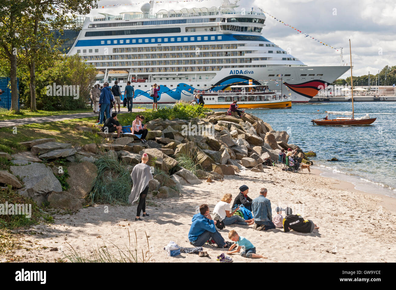 Spectators watching passing boats at the 2016 Hanse Sail at Rostock Warnemünde , Germany. Stock Photo