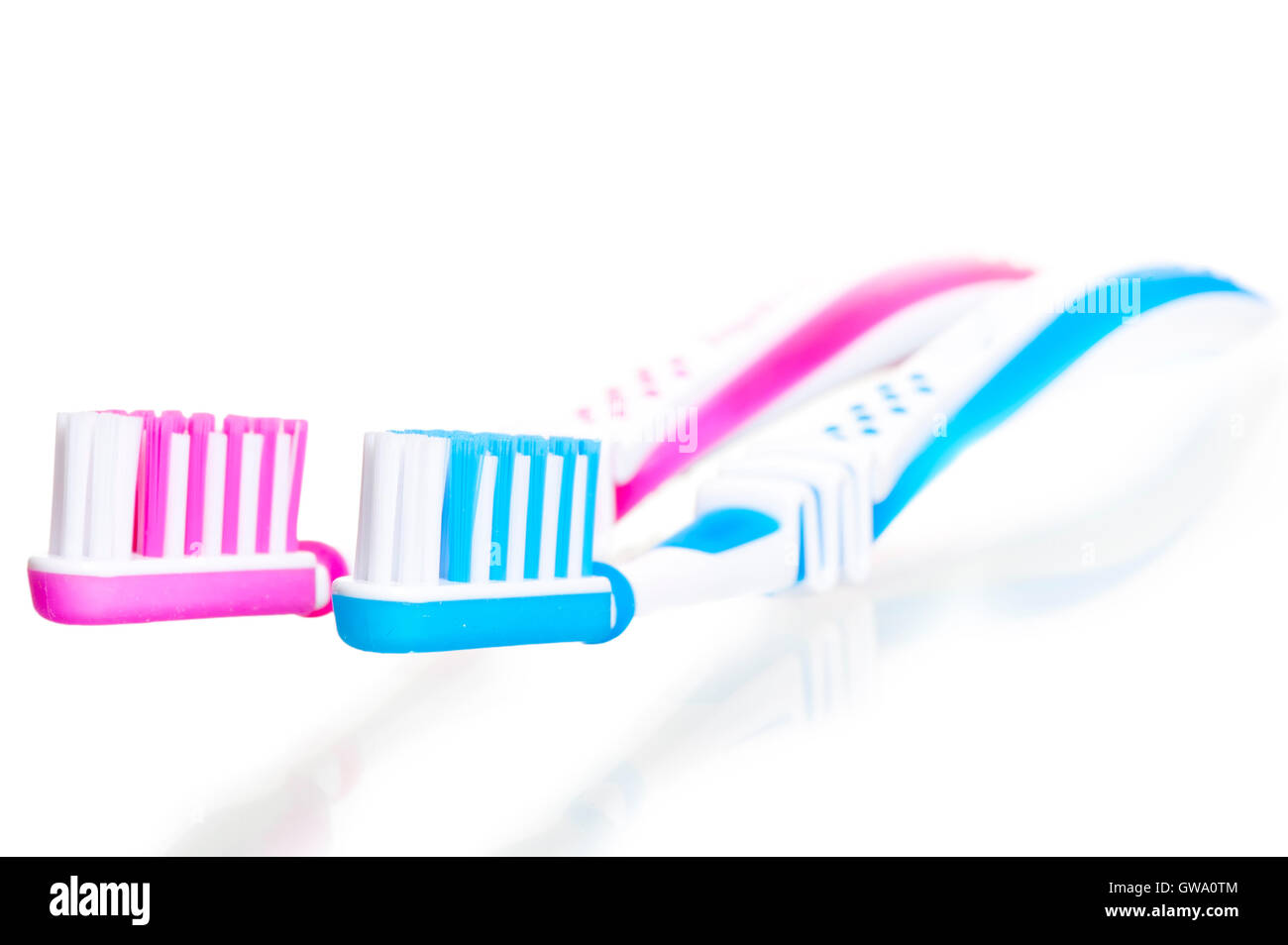 two toothbrushes are on white background Stock Photo - Alamy