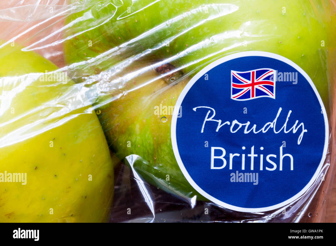 Proudly British label with Union Jack flag on a bag of Bramley cooking apples from Waitrose. Stock Photo