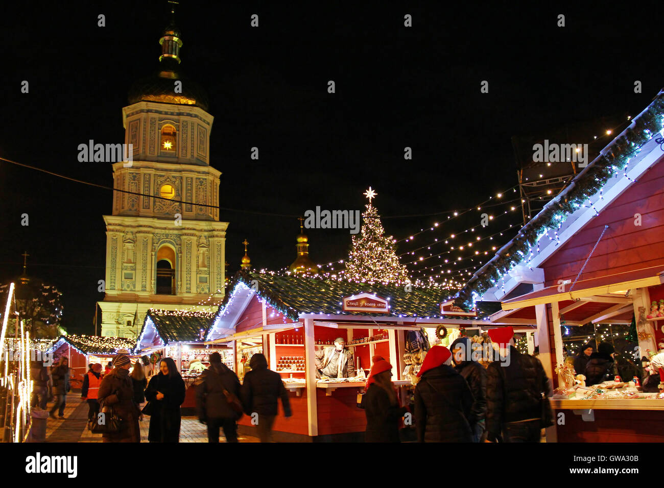 KYIV, UKRAINE - DECEMBER 25, 2014: St. Sophia Cathedral and Christmas market on Sophia Square in Kyiv Stock Photo