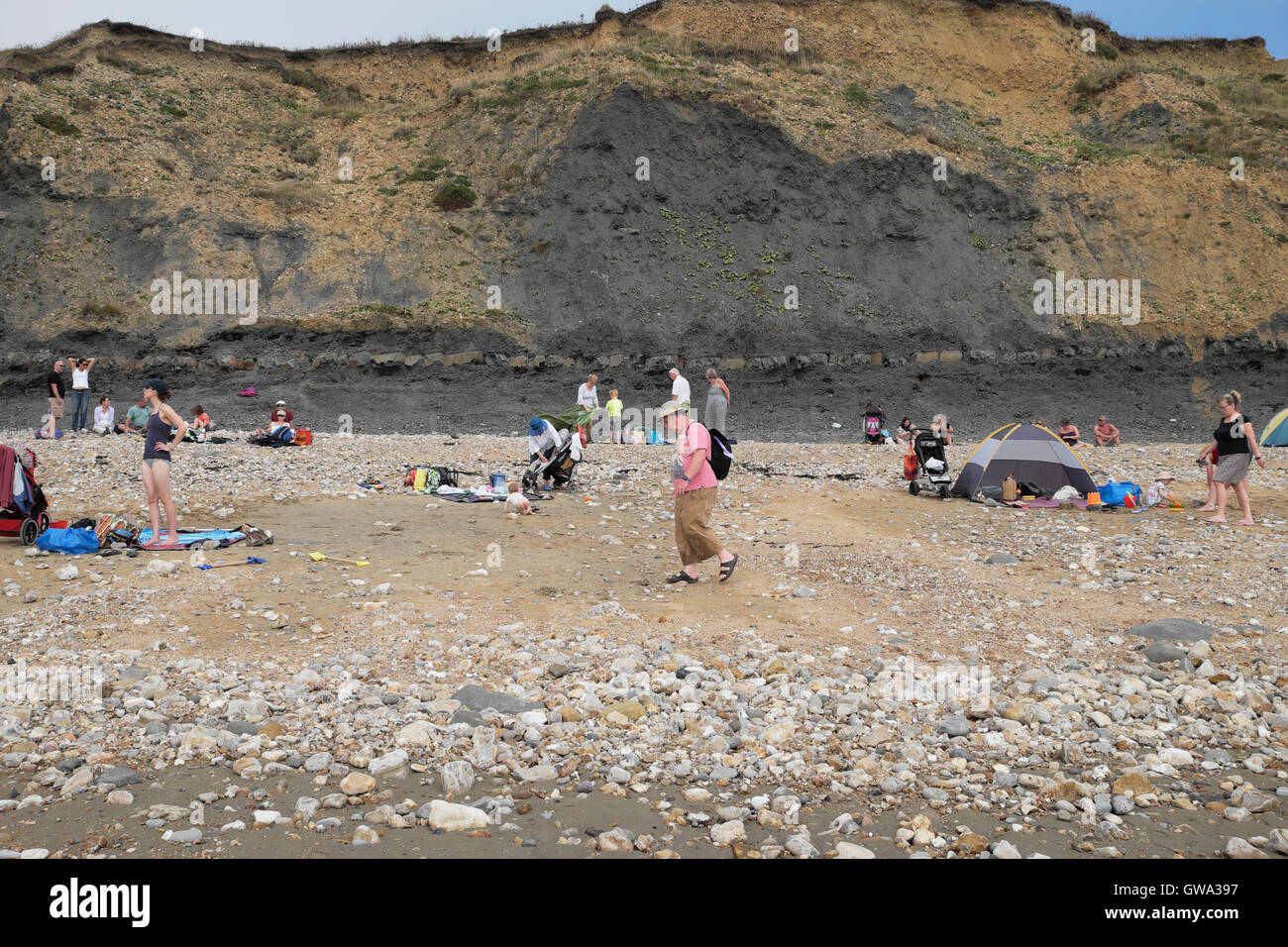 People on the beach at Charmouth, Jurassic Coast, Dorset UK  KATHY DEWITT Stock Photo