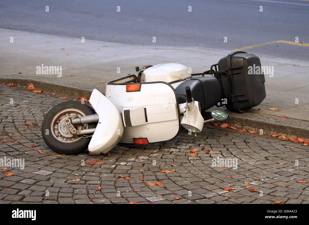Scooter down on the street Stock Photo Alamy