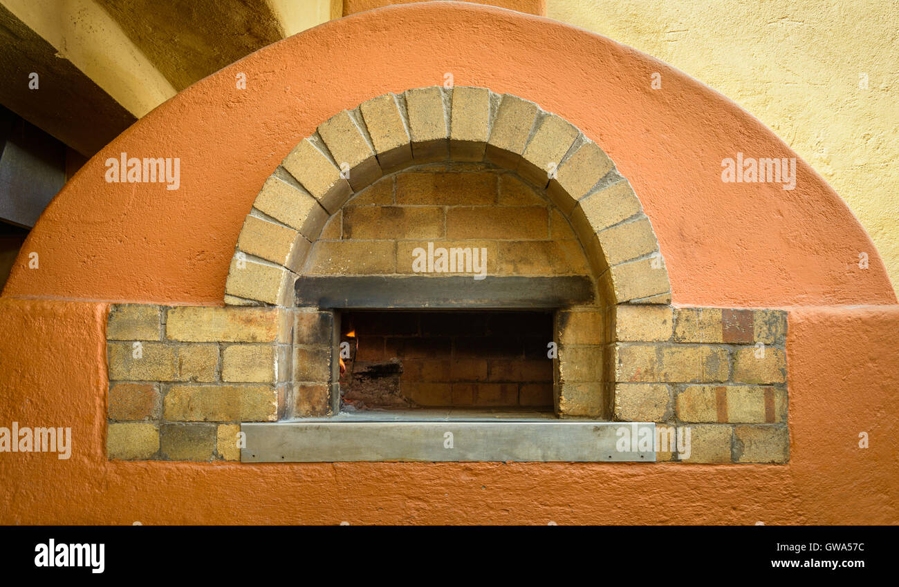 Wood fire pizza oven in an Italian restaurant Stock Photo