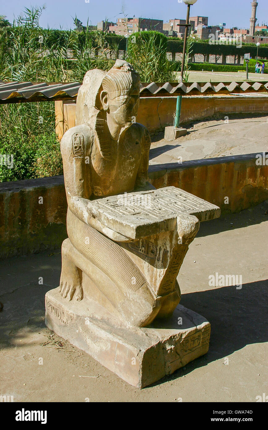 Egypt, Cairo, Heliopolis, open air museum, obelisk parc. The king Sethy II presents an offering table. Stock Photo