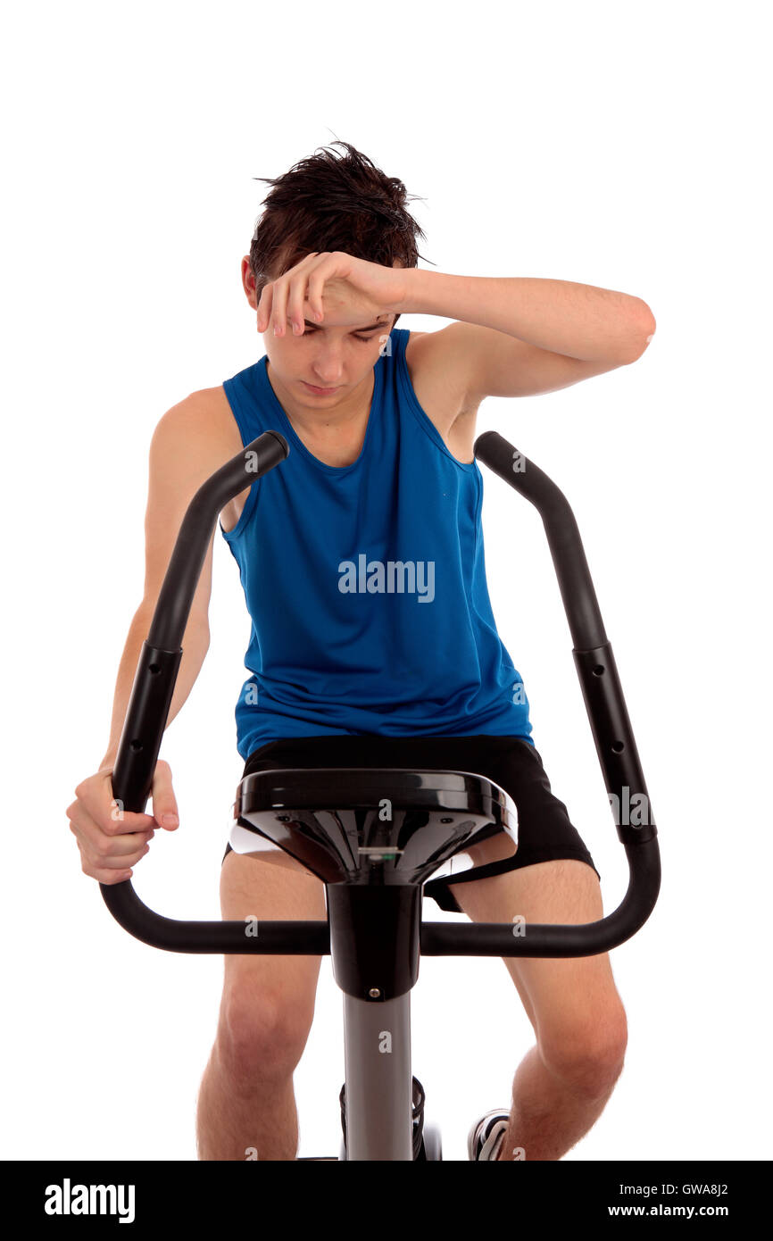 Exhausted after workout on exercise bike Stock Photo - Alamy