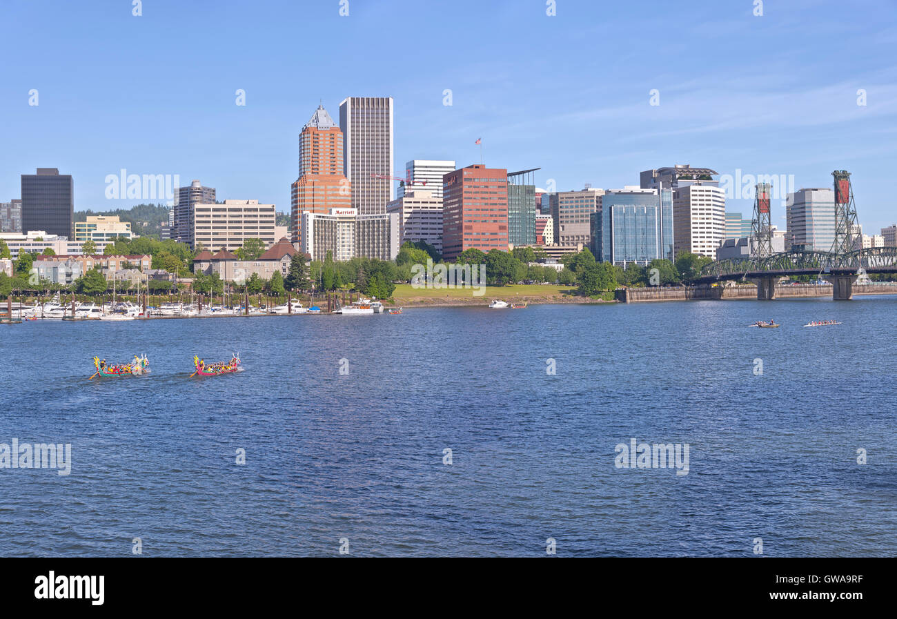 Portland Oregon skyline and dragon boats rowing in morning light. Stock Photo