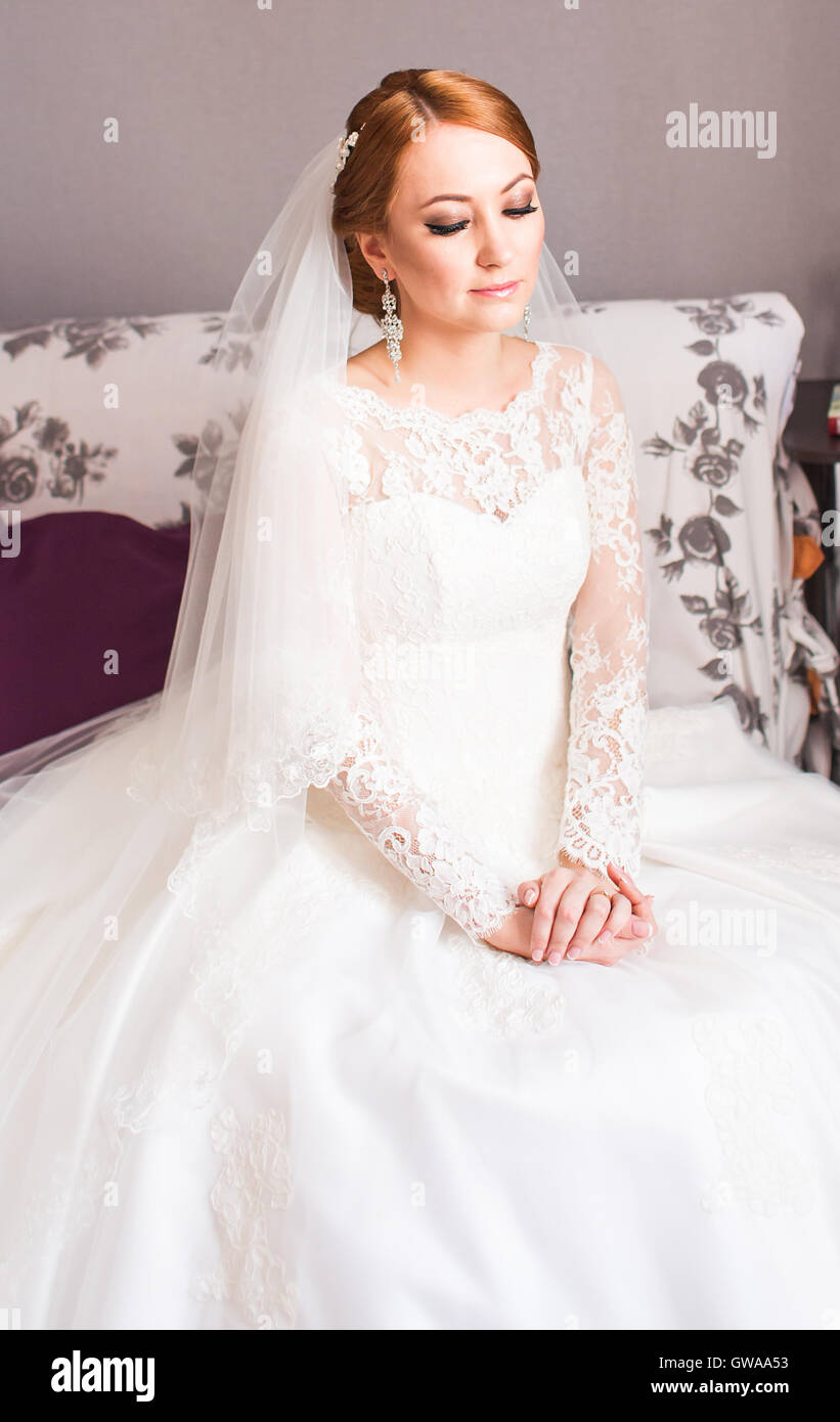Portrait of pretty bride in the room Stock Photo - Alamy