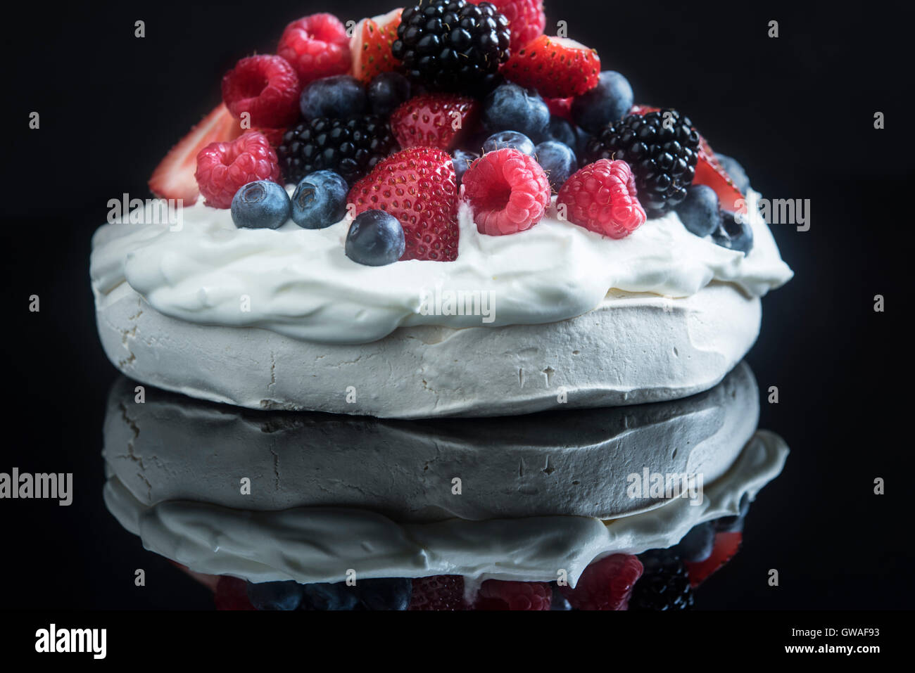 Pavlova with mixed berries Stock Photo