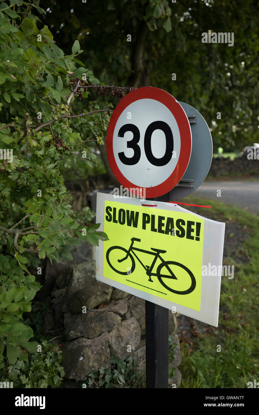 Speed limit sign with cycle event advisory. Stock Photo