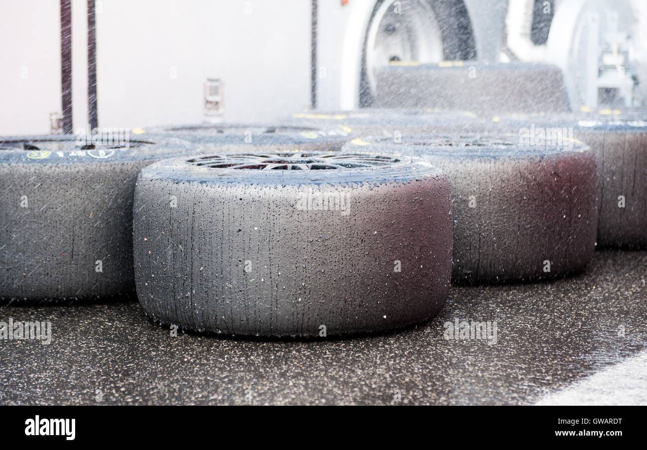 Slick racing tire set refreshment with water wet in pit detail Stock Photo