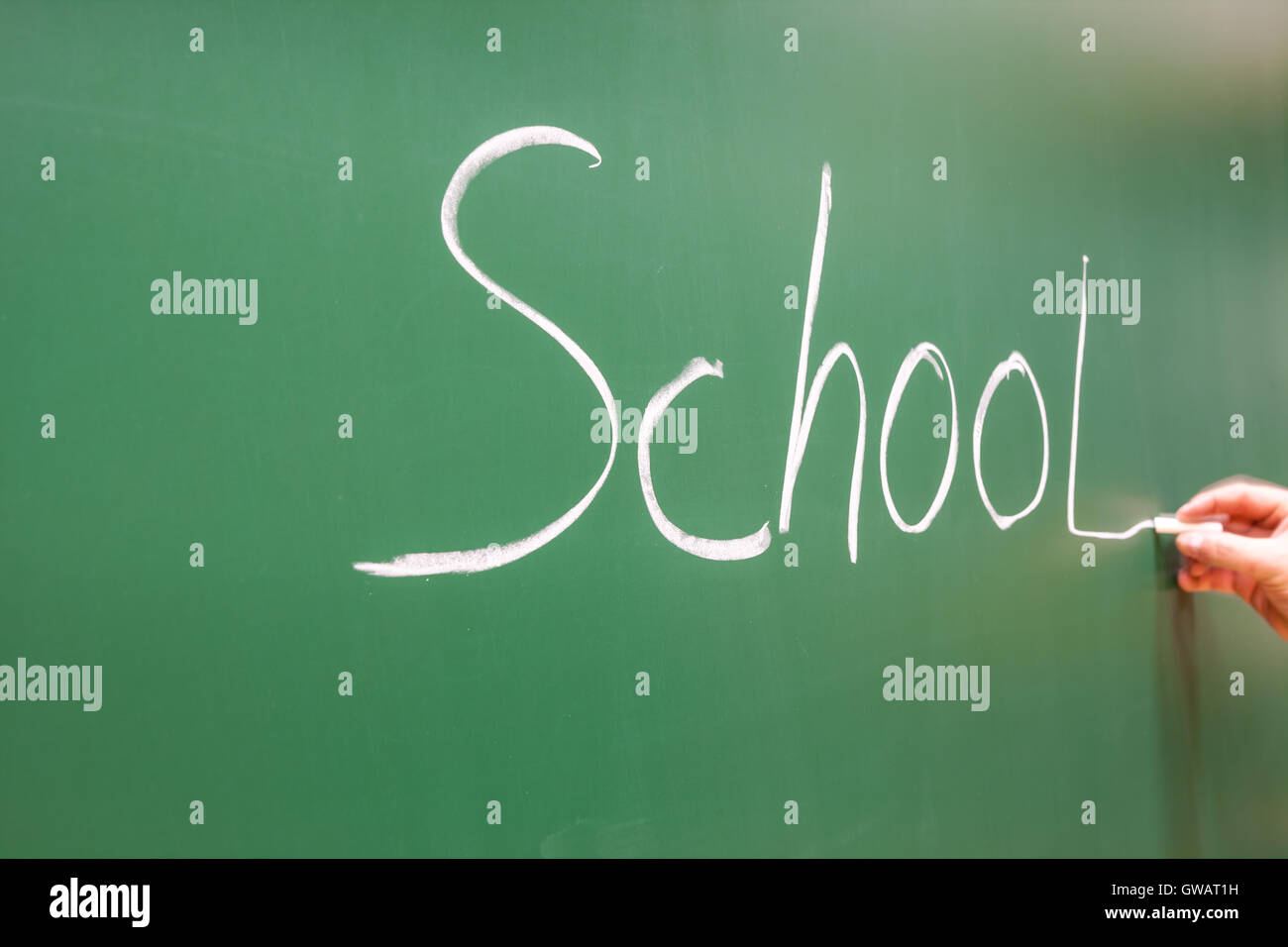 in the class, there is a word school on a drawing board Stock Photo
