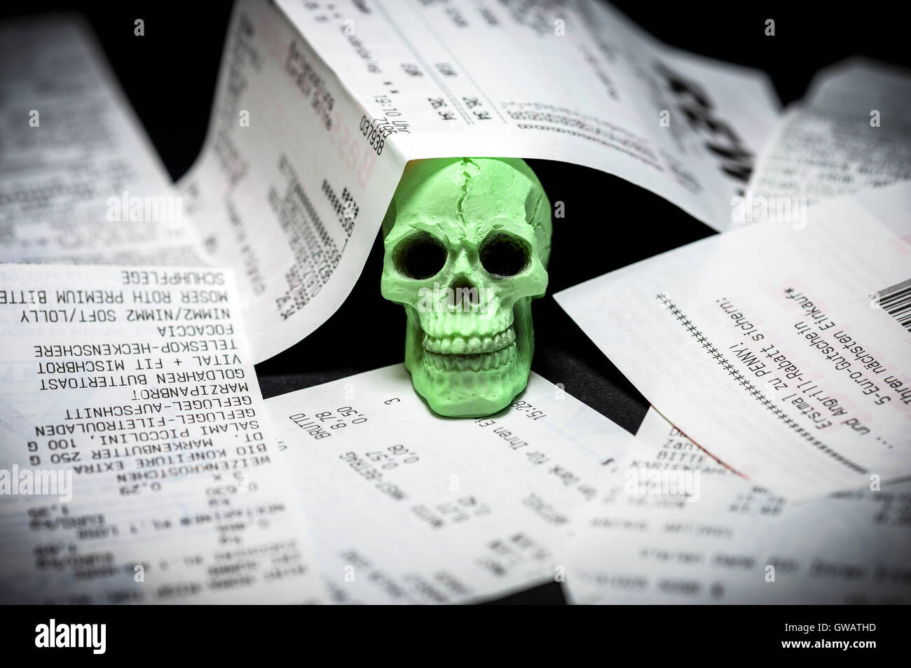Receipts and death's-head, injurious Bisphenol A in thermo paper, Kassenbons und Totenkopf, schaedliches Bisphenol A in Thermopa Stock Photo
