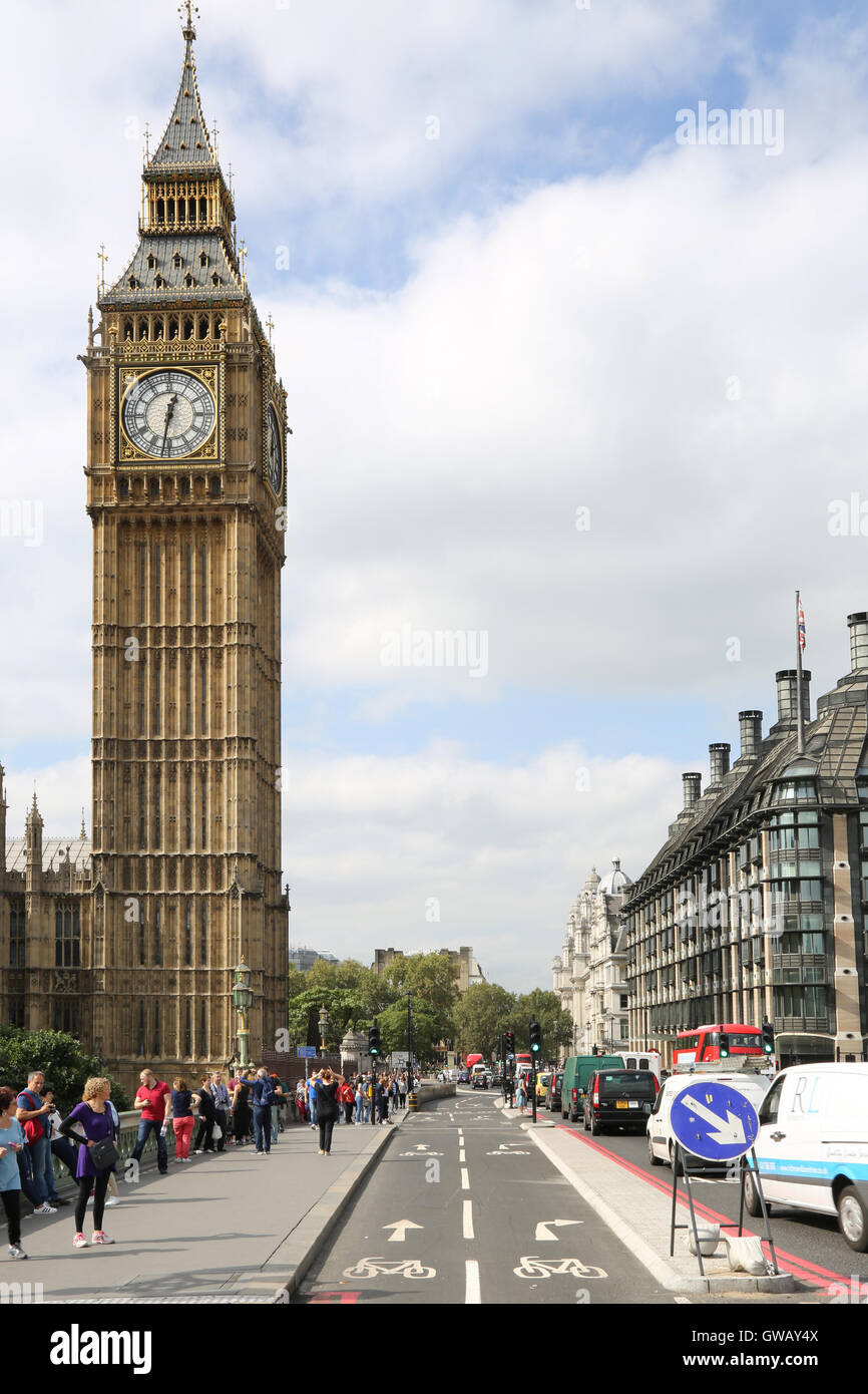 The new segregated cycle lane on Westminster Bridge, London, UK. Shows Big Ben and Portcullis House beyond Stock Photo