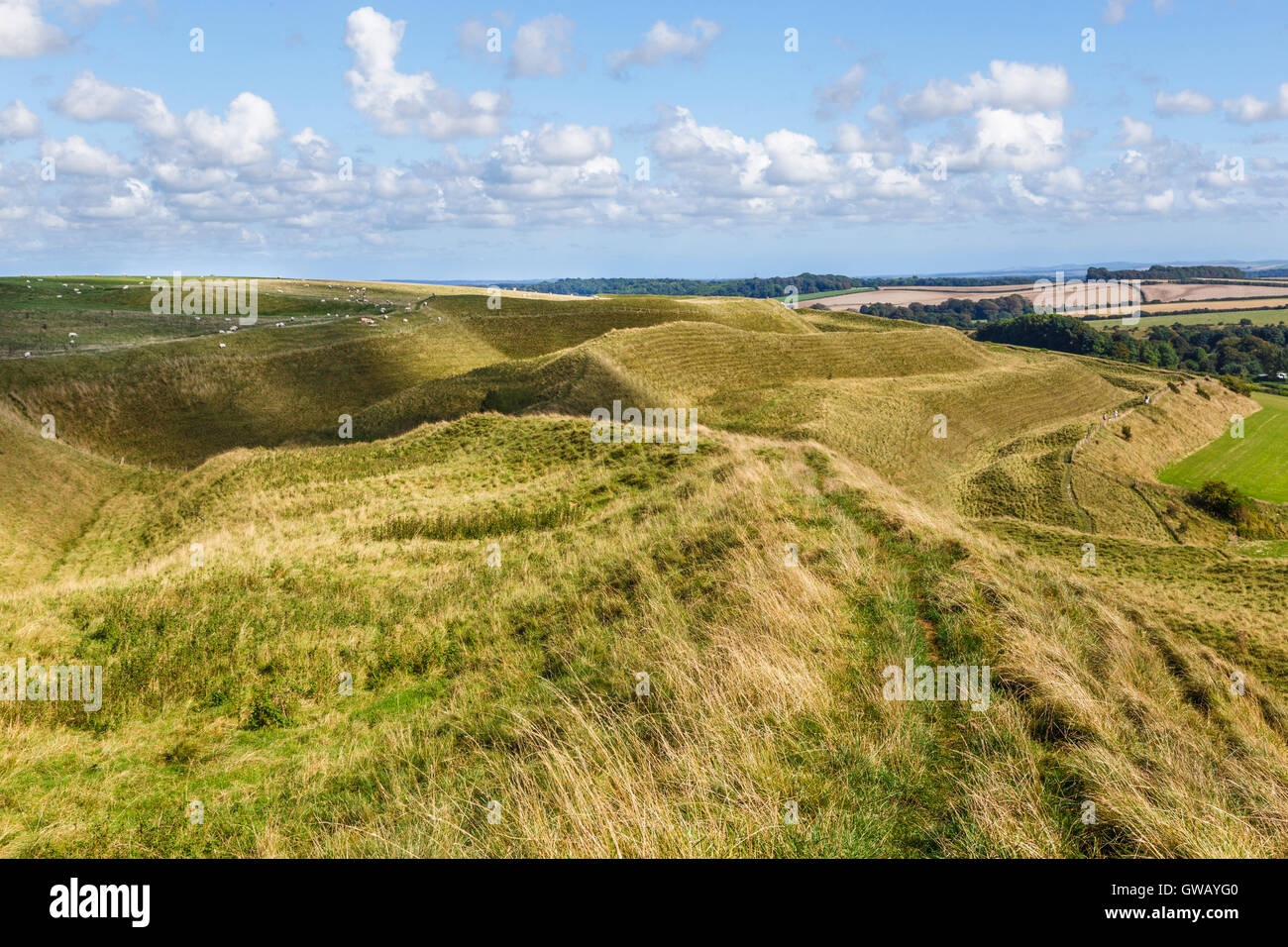 Ditches and ramparts on north side of Maiden Castle Stock Photo