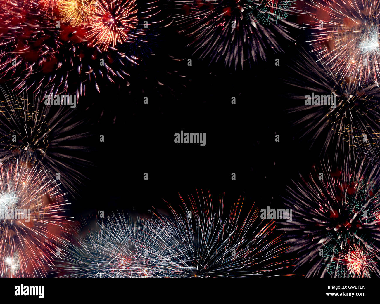 Border (frame) composed of firework flares isolated on black background with empty copy space in the middle to insert some text Stock Photo
