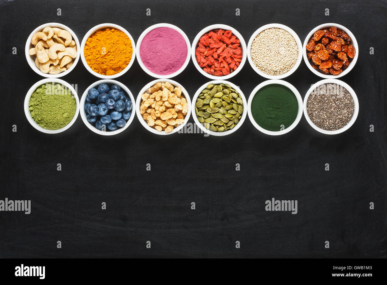 Superfoods collection on chalkboard as background. Empty space for text ...