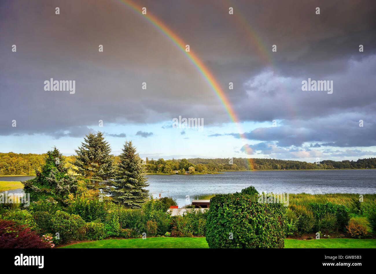 Rainbows about the big Poenitzer lake in Schleswig - Holstein, Germany, Europe, Regenbogen ueber dem Grossen Poenitzer See in Sc Stock Photo
