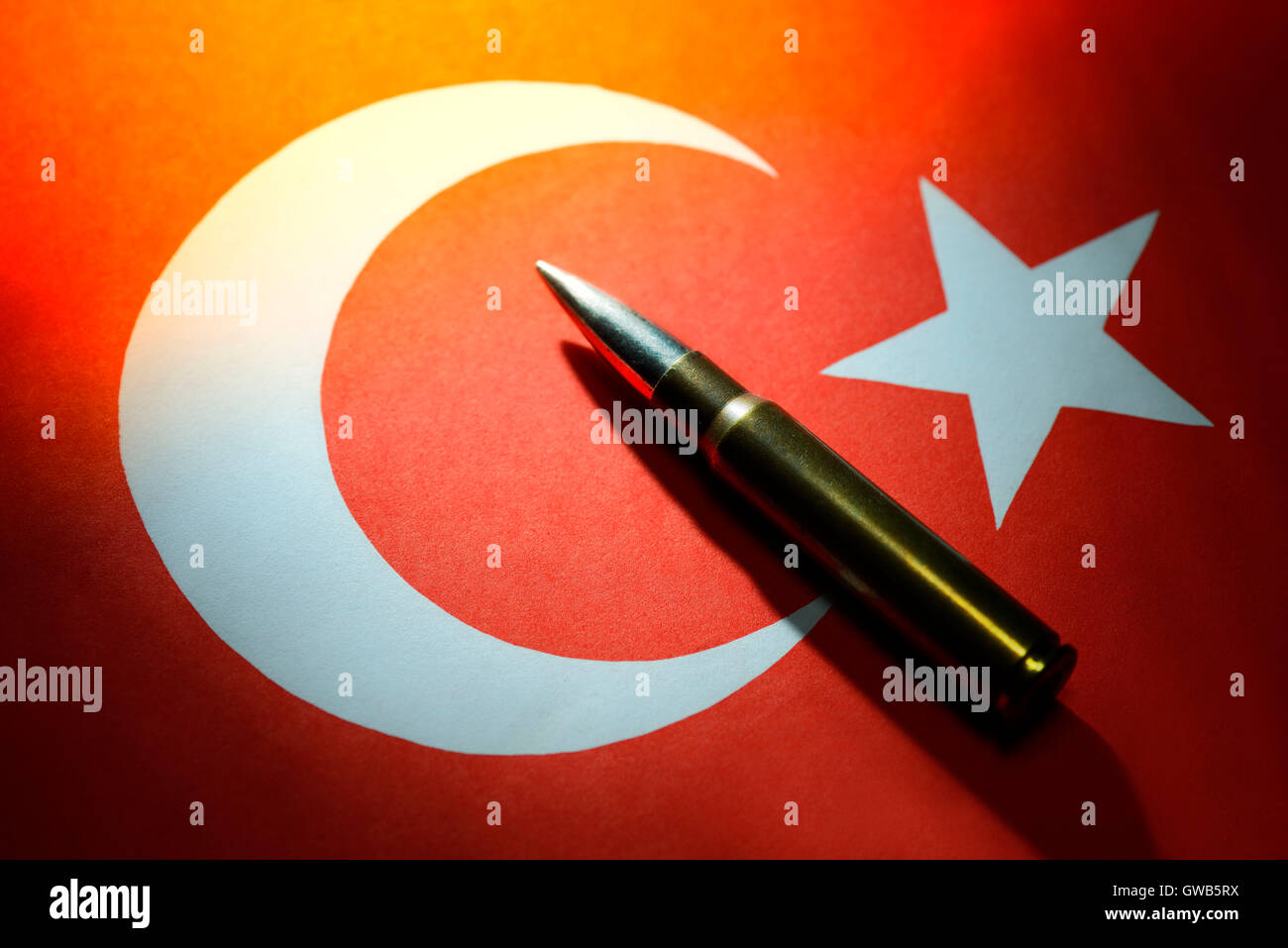 Cartridge on Turkish flag, symbolic photo for the reproach of the support of terrorist groupings, Patrone auf tuerkischer Fahne, Stock Photo