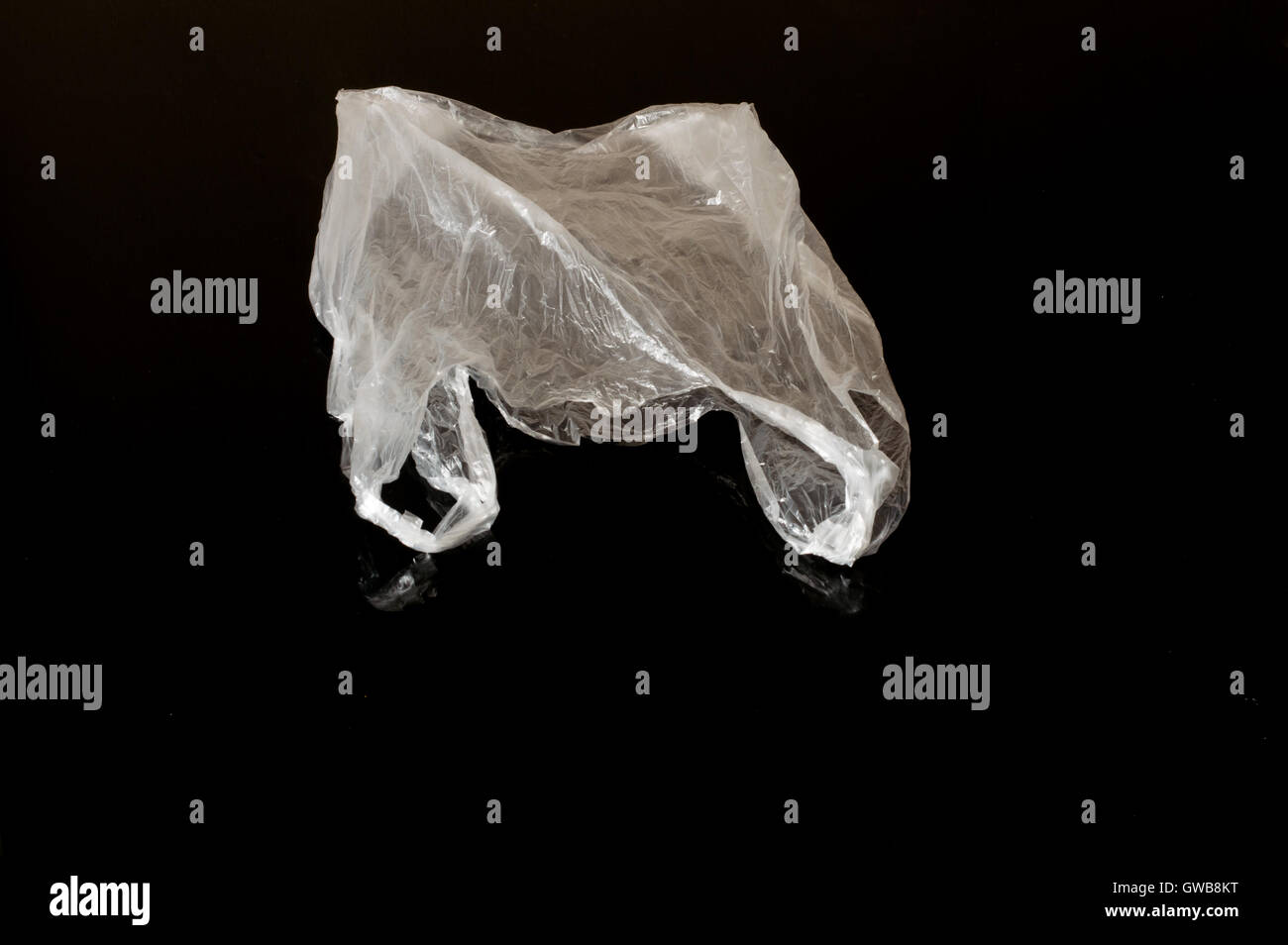 White Plastic Bag Isolated On Dark Background Stock Photo - Alamy