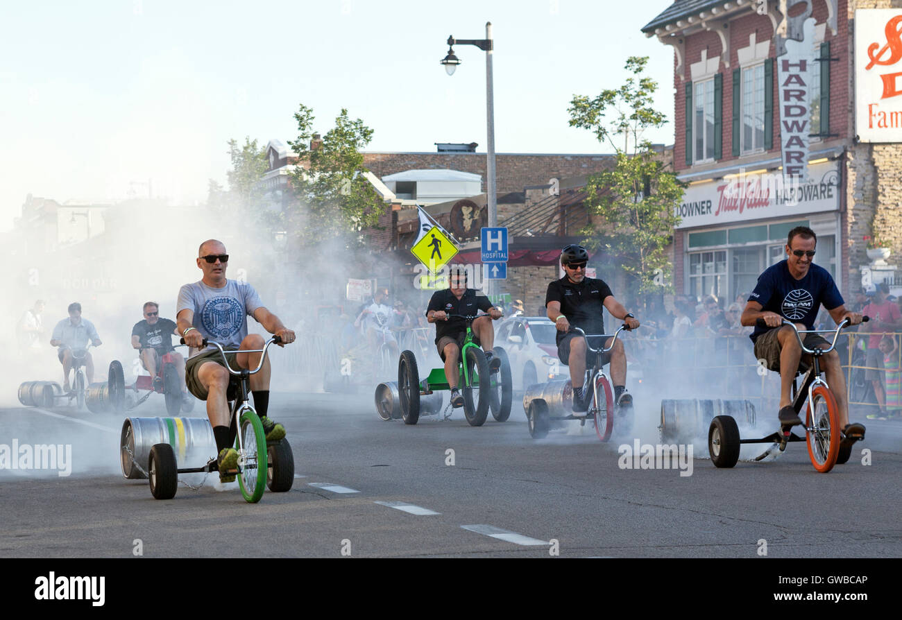 Adult tricycle racing precedes the Downer Avenue bike race, an annual event  of the Tour of America's Dairyland in Milwaukee, Wisconsin, USA Stock Photo  - Alamy