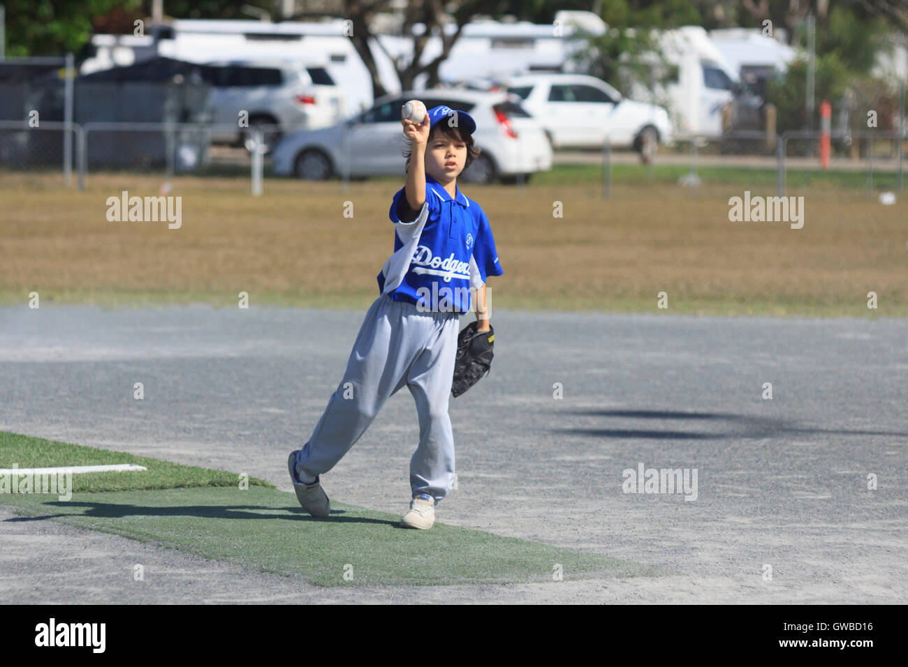 A young boy pitches during a Rookie Ball baseball game in Cairns
