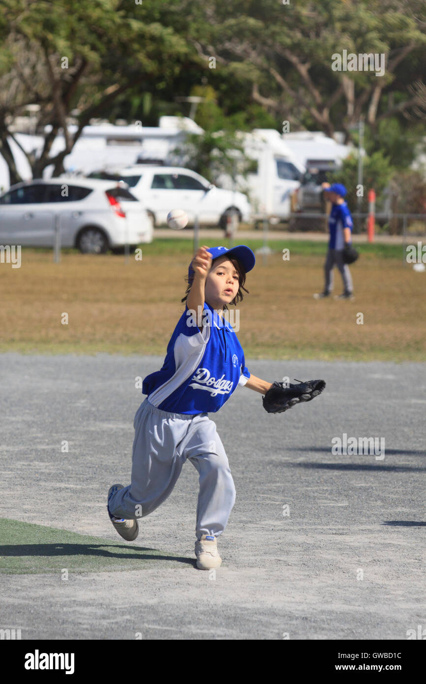 A young boy pitches during a Rookie Ball baseball game in Cairns
