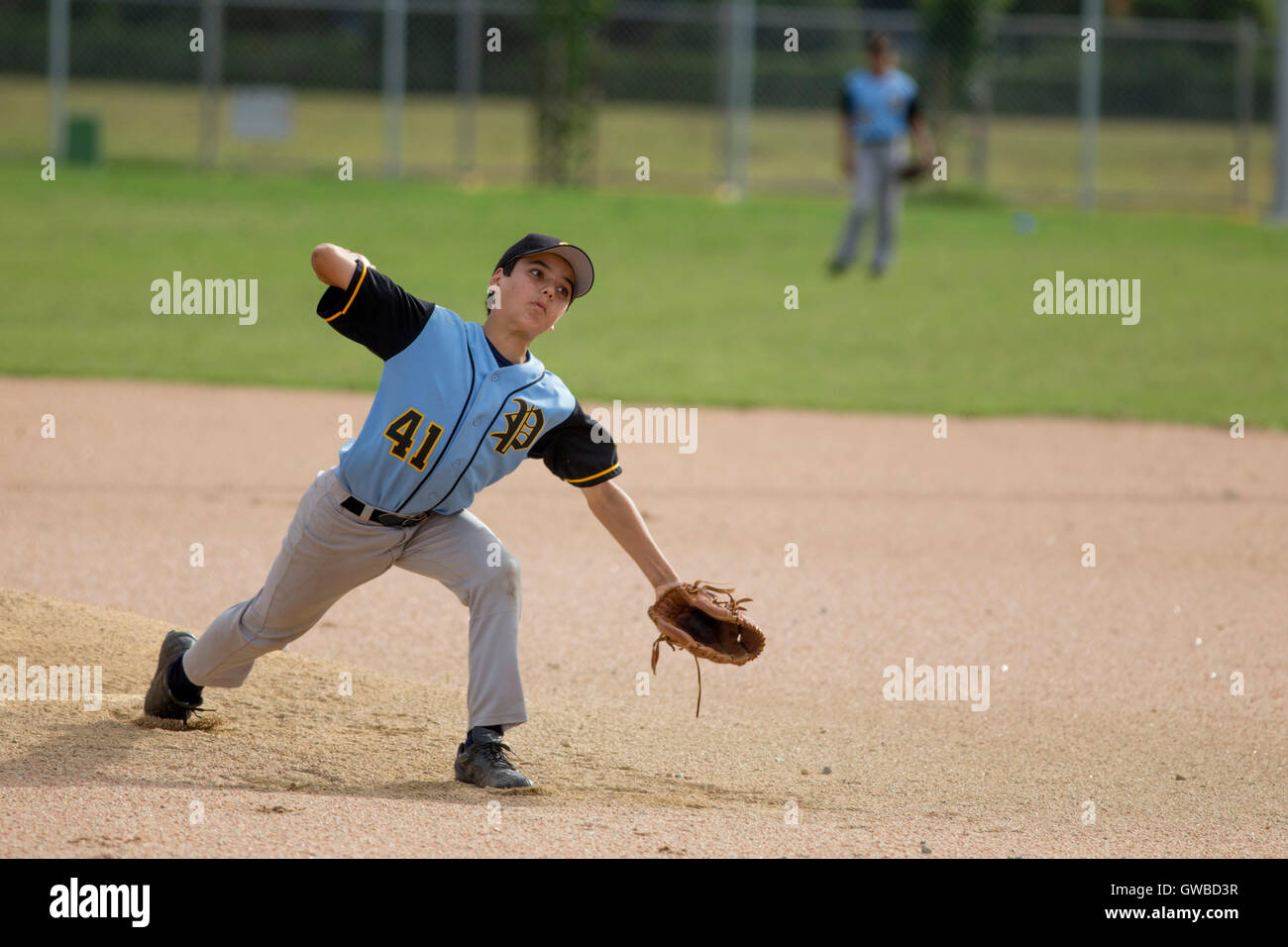 A teenage boy pitches during a baseball game in Cairns, Australia Stock