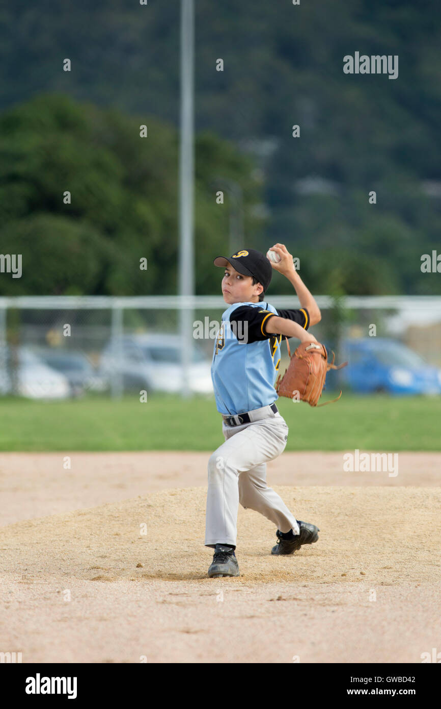 A teenage boy pitches during a baseball game in Cairns, Australia Stock