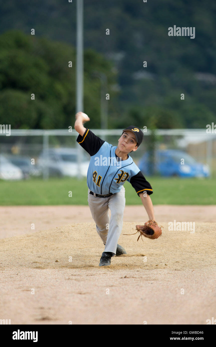 A teenage boy pitches during a baseball game in Cairns, Australia Stock