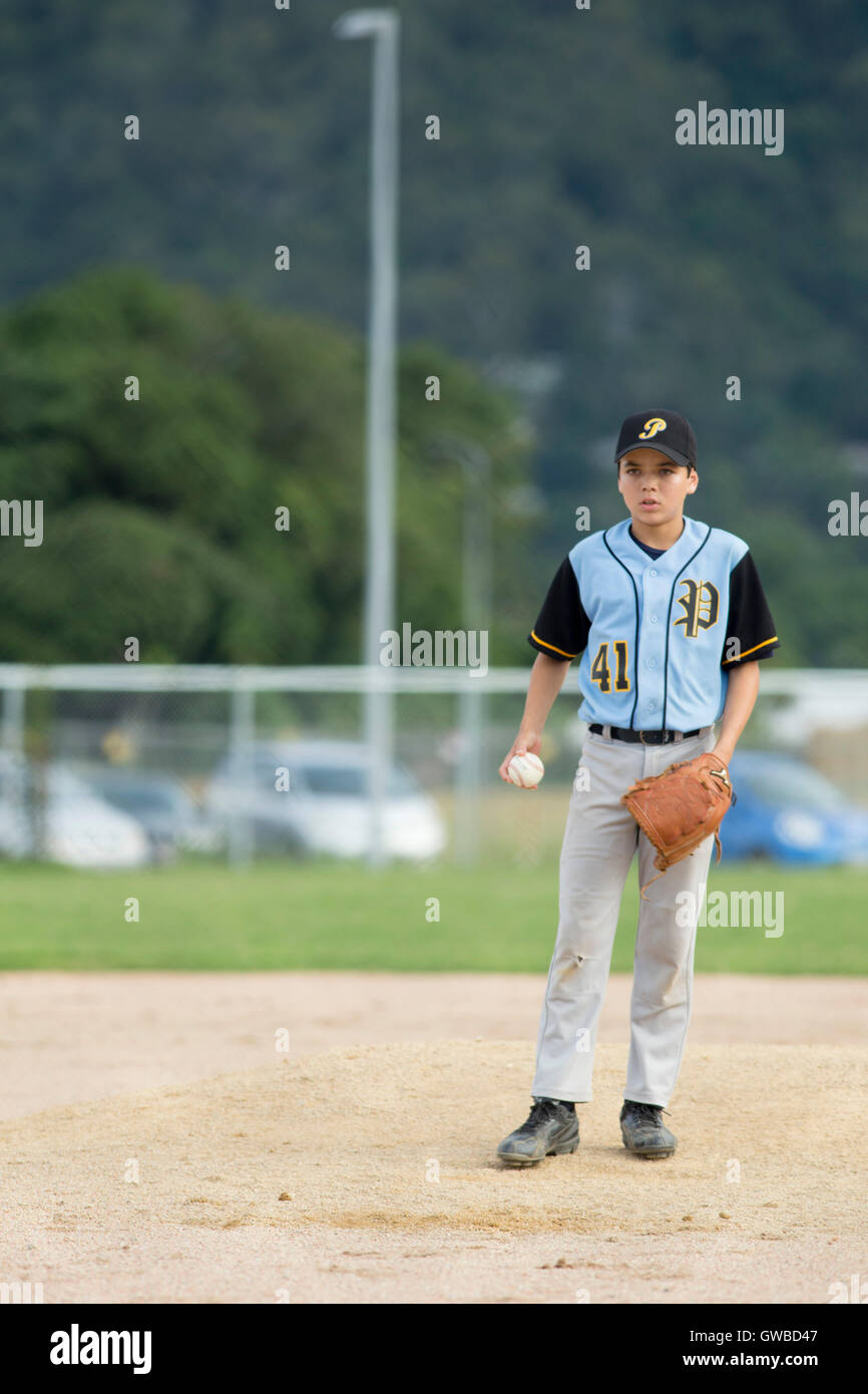 A teenage boy pitches during a baseball game in Cairns, Australia Stock
