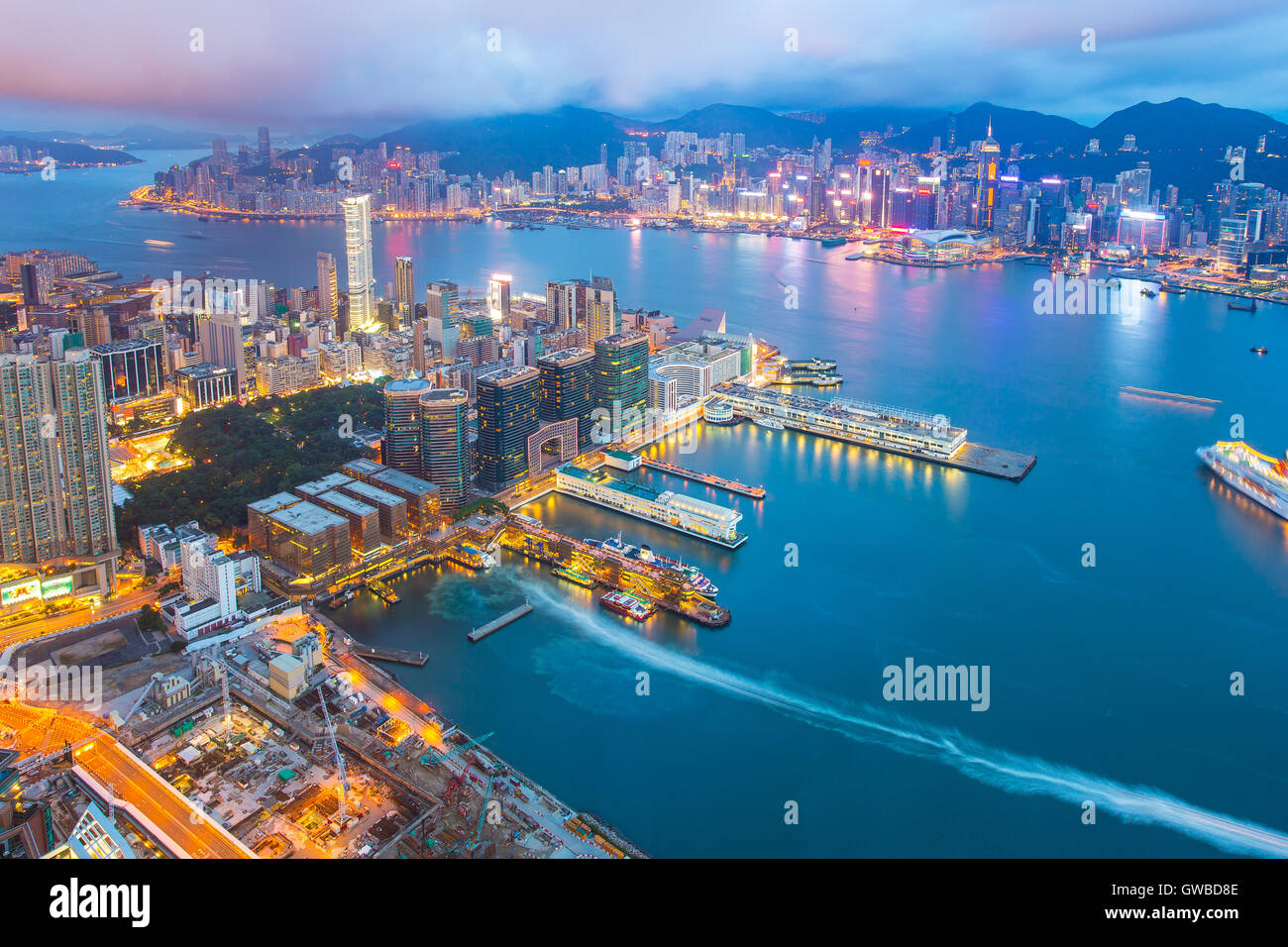 Night at the Victoria Harbor in Hong Kong city skyline. Stock Photo
