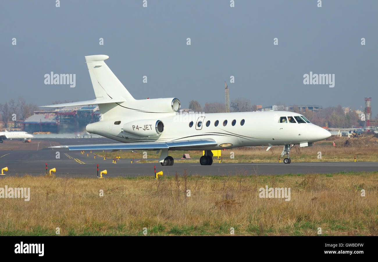 Kiev, Ukraine - November 5, 2011: Dassault Falcon 50EX business jet is on the runway in the airport before takeoff Stock Photo