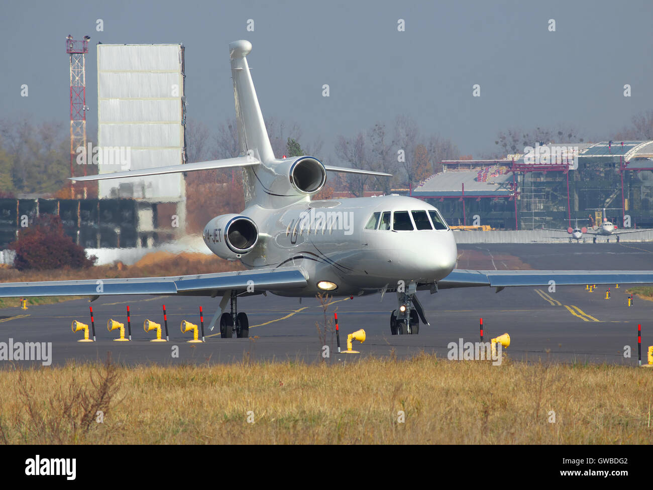 Kiev, Ukraine - November 5, 2011: Dassault Falcon 50EX business jet is taxiing to the runway in the airport Stock Photo