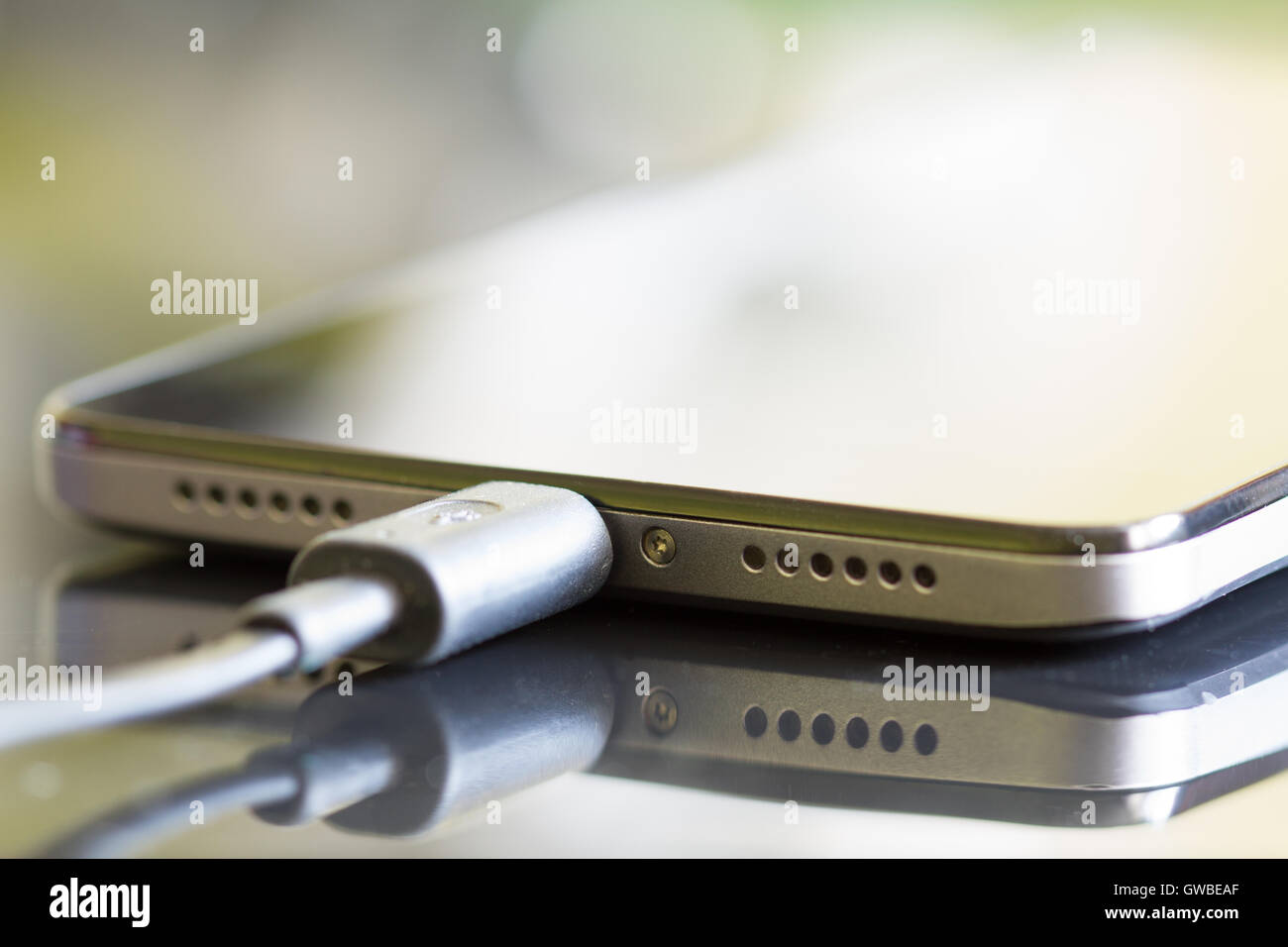 Smartphone battery charging technology background concept Stock Photo