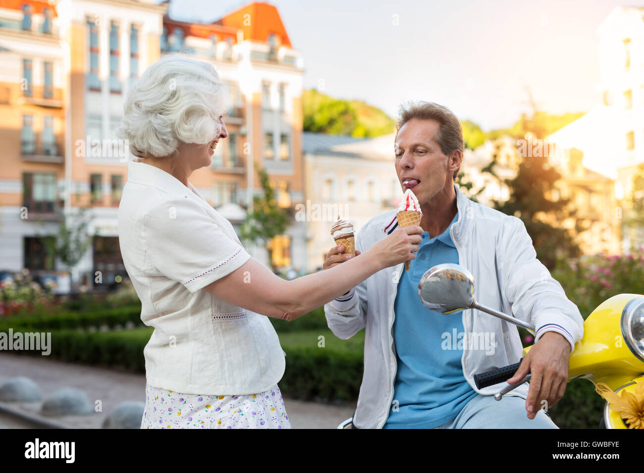Adult man eats ice cream Stock Photo Alamy