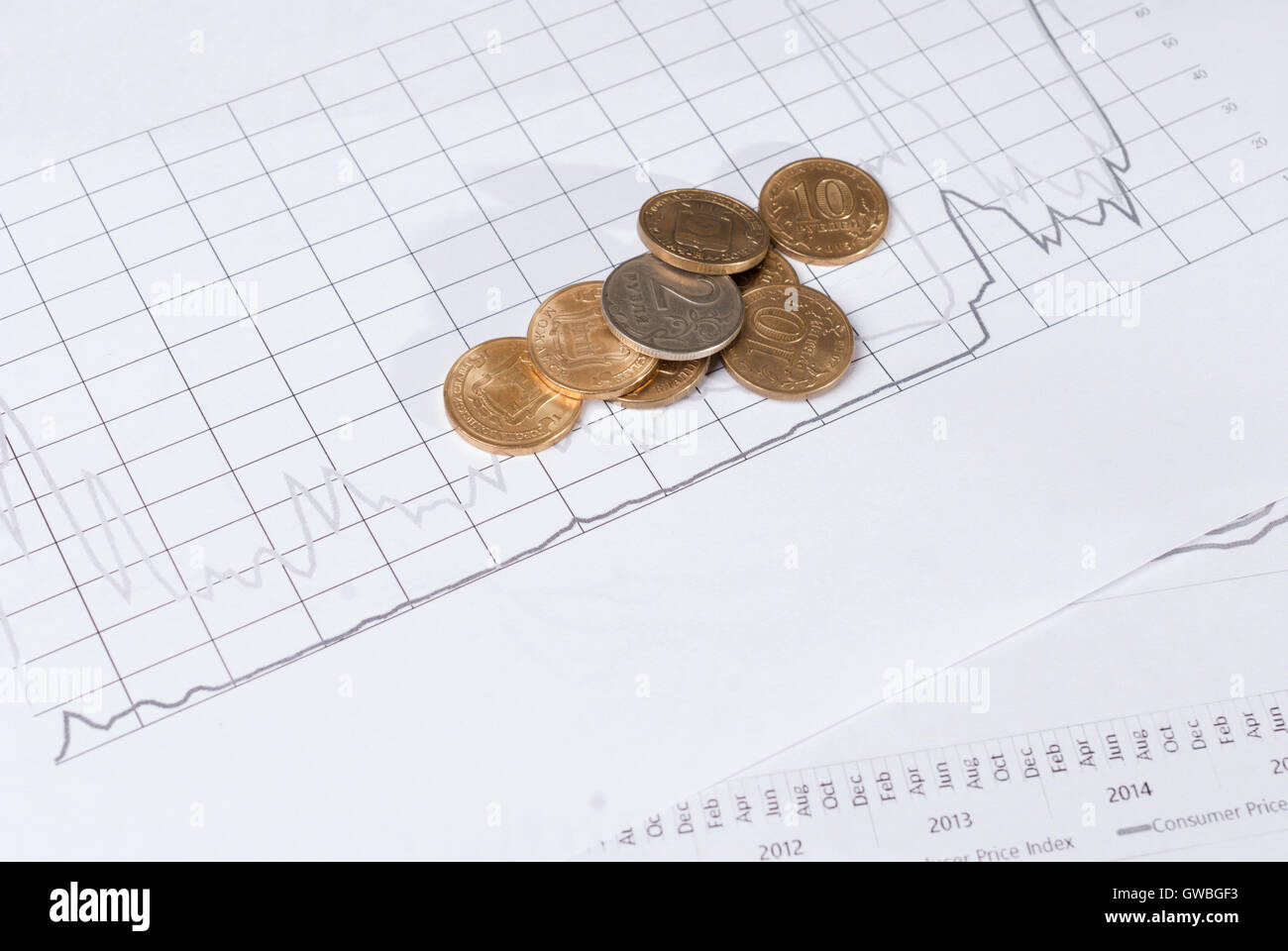 Stacks of coins on financial charts. Concept business investment plan Stock Photo