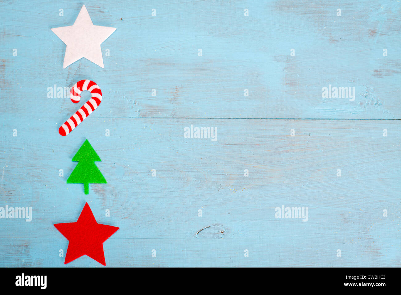 Christmas background of flat lay felt decoration on blue wooden table with copy space on your text. Stock Photo