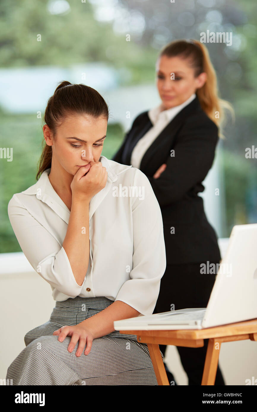 Work colleague intimidating another Stock Photo