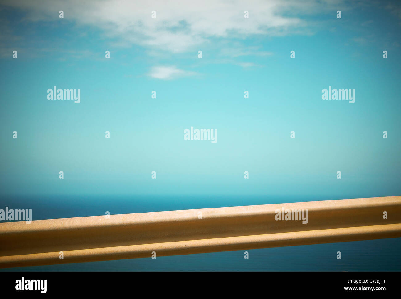 Crash barrier detail and blue sky in Spain. Horizontal Stock Photo