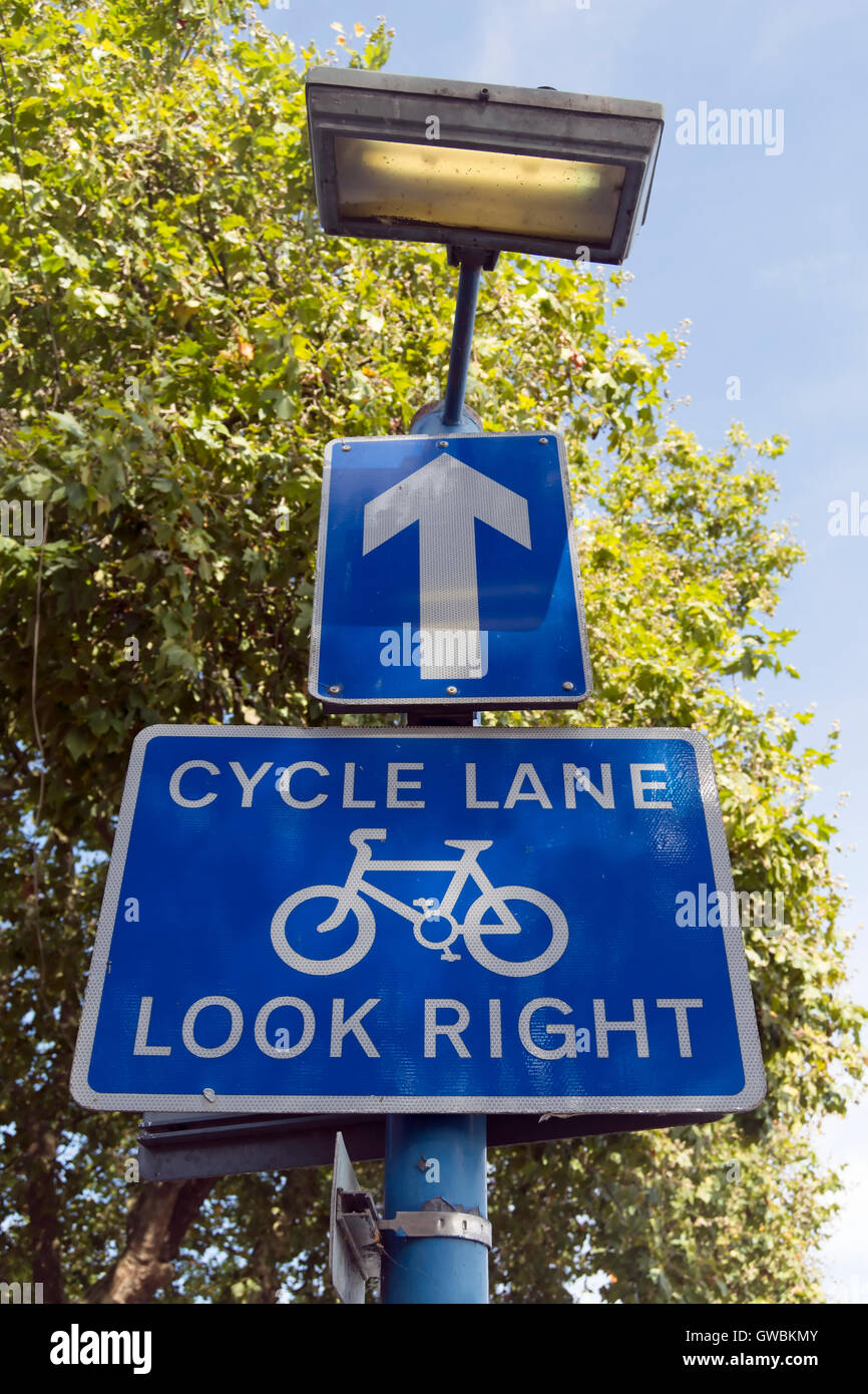 cycle lane look right sign with direction arrow and lamp, in putney