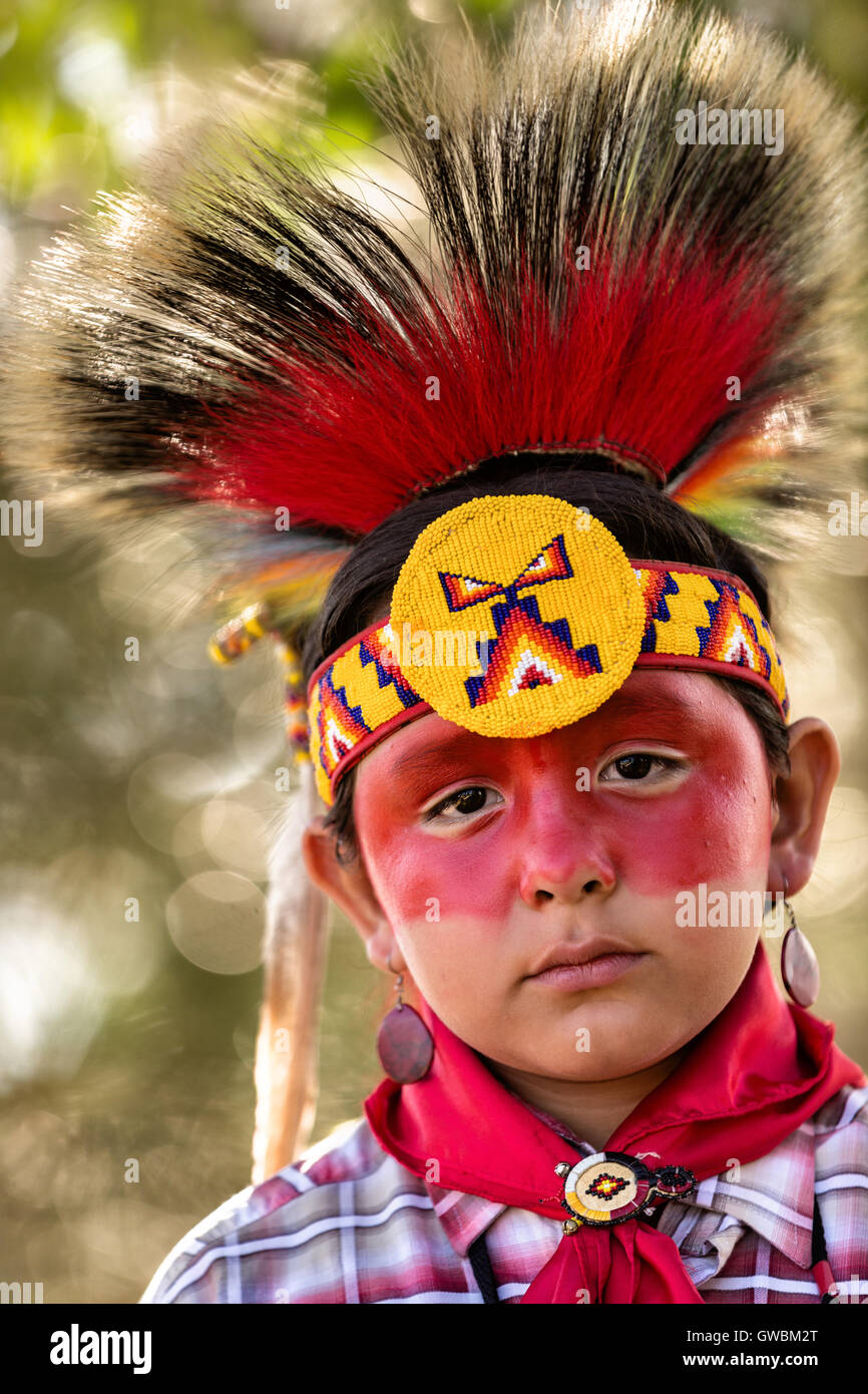 A young Native American dancer from the Arapahoe people dressed in