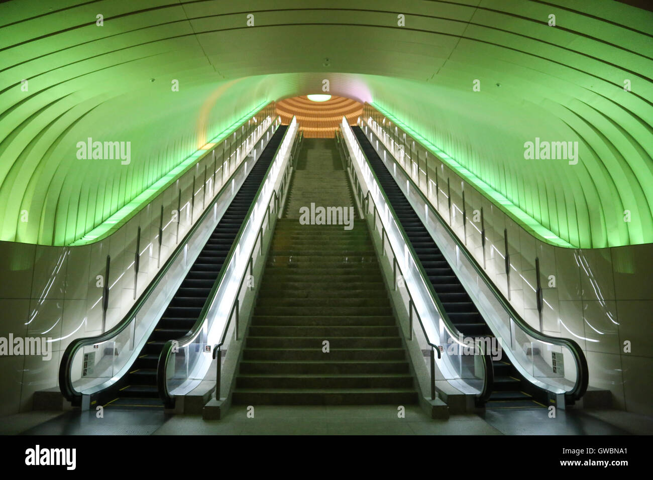 Two Escalators with Green Light overhead Stock Photo Alamy