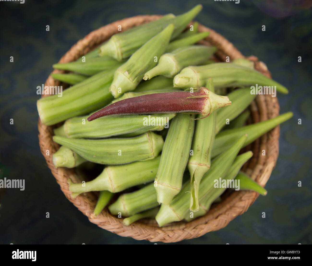 Basket of green and red Okra Stock Photo Alamy