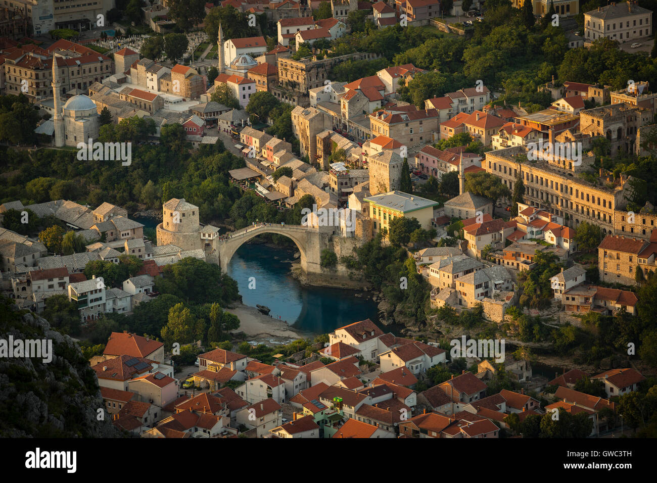An aerial view of the Neretva river which runs across old Mostar and its Old Bridge (Stari Most). Bosnia Herzegovina From above. Stock Photo