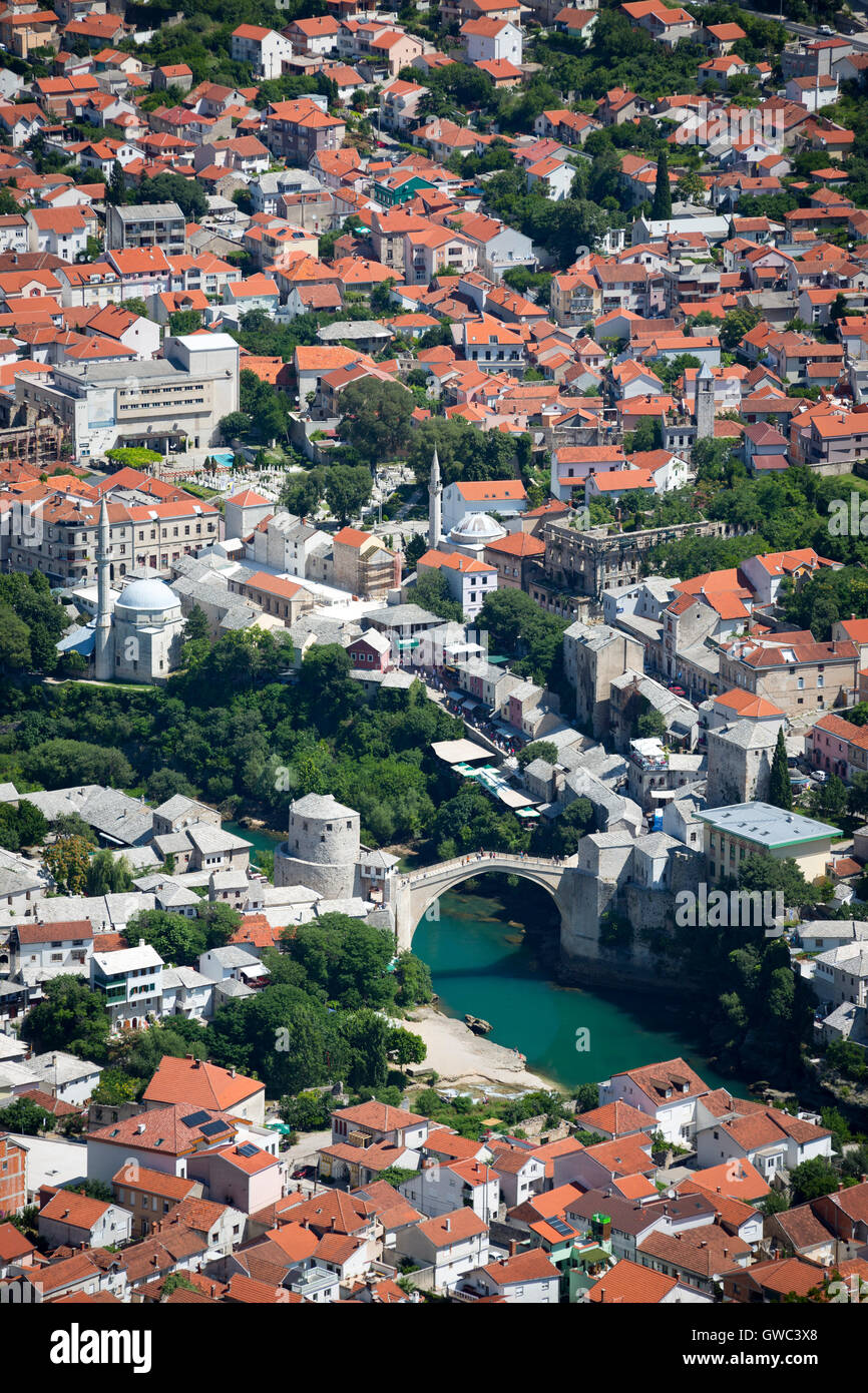 An aerial view of the Neretva river which runs across old Mostar and its Old Bridge (Stari Most). Bosnia Herzegovina From above. Stock Photo